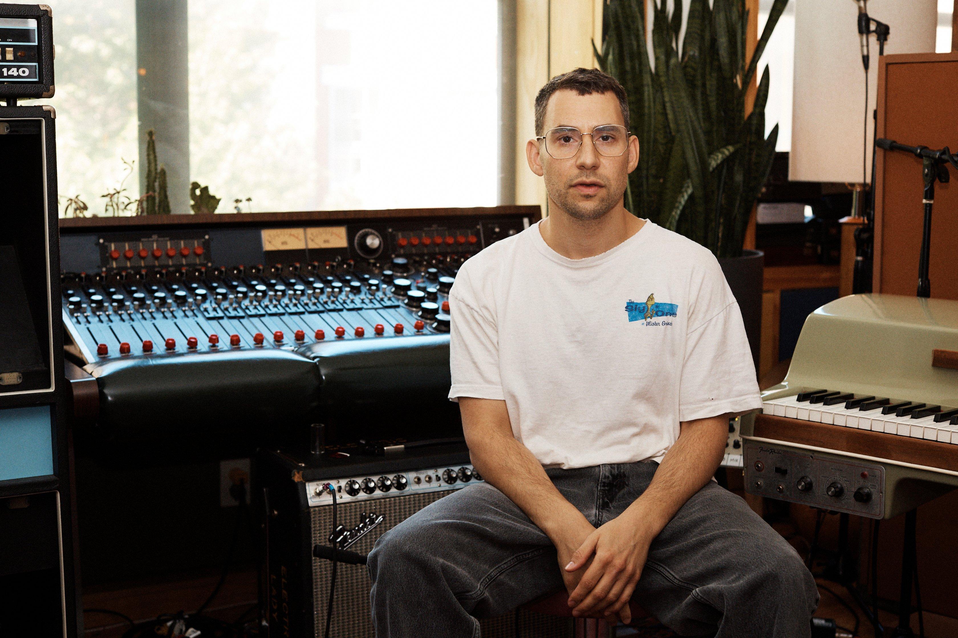 Jack Antonoff in studio next to a mixing board